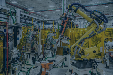 Robotic arms operate on an assembly line to create products