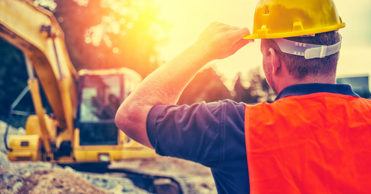 Construction worker following heat safety standards